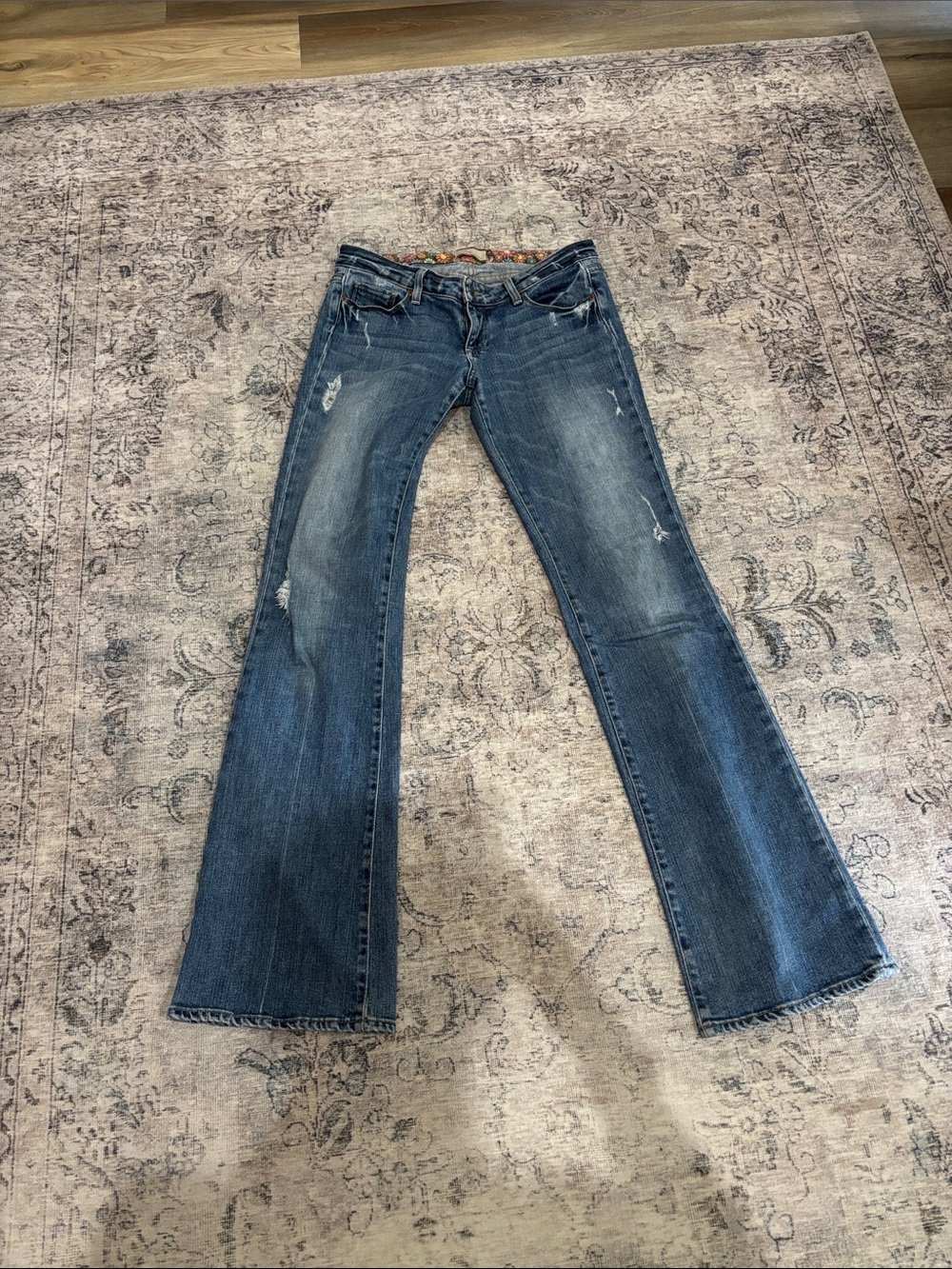PAIGE Dark Blue Flared Jeans with Subtle Distressing